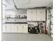 Organized garage space with pegboard and plenty of storage cabinets for tools and equipment at 4011 99Th W St, Bradenton, FL 34210