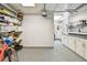 Garage with built-in storage shelves, utility sink and access to the backyard at 4011 99Th W St, Bradenton, FL 34210
