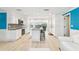 Modern kitchen featuring white cabinetry, stainless steel appliances, and an eat-in island at 4011 99Th W St, Bradenton, FL 34210