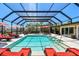 The sparkling swimming pool features an attached spa and is completely enclosed with a screen for year-round enjoyment at 4011 99Th W St, Bradenton, FL 34210