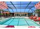 A private outdoor oasis offers a sparkling pool and spa with ample seating, all enclosed in a screened lanai at 4011 99Th W St, Bradenton, FL 34210