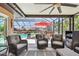 A stunning pool area with seating, a full screen enclosure, and a great view create the perfect spot for outdoor fun at 4011 99Th W St, Bradenton, FL 34210