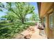 This backyard boasts lush lawn, mature trees, and serene water views at 4144 Hampton Dr # C, New Port Richey, FL 34652