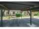 View from carport of the condo complex, complete with mature landscaping at 4144 Hampton Dr # C, New Port Richey, FL 34652