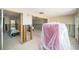 Open-concept living space under renovation, connecting to a bathroom at 4144 Hampton Dr # C, New Port Richey, FL 34652