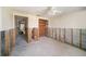 Renovated living room showing construction progress with exposed studs and concrete block walls at 4144 Hampton Dr # C, New Port Richey, FL 34652