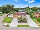 An aerial view showcases the home's landscaped yard, circular driveway, and inviting exterior at 4500 22Nd N Ave, St Petersburg, FL 33713