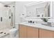 Modern bathroom boasts frameless glass shower, sleek vanity, and LED backlit mirror at 4500 22Nd N Ave, St Petersburg, FL 33713
