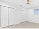 Bright bedroom features a ceiling fan and multiple closets at 4500 22Nd N Ave, St Petersburg, FL 33713