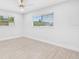 Bright empty bedroom with two large windows and wood-look floors at 4500 22Nd N Ave, St Petersburg, FL 33713
