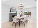 Dining room with a fireplace, modern lighting, and sliding glass doors, perfect for indoor/outdoor living at 4500 22Nd N Ave, St Petersburg, FL 33713