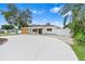 Beautiful renovated single-story home featuring a circular driveway and modern wood accents at 4500 22Nd N Ave, St Petersburg, FL 33713