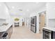 Bright, open kitchen with stainless steel refrigerator, sleek cabinets, and easy access to other rooms at 4500 22Nd N Ave, St Petersburg, FL 33713