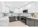 Contemporary kitchen with white and gray cabinetry, stainless steel appliances, and ample counter space at 4500 22Nd N Ave, St Petersburg, FL 33713