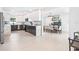 Modern kitchen featuring sleek cabinetry, stainless steel appliances, marble countertops and adjacent dining area at 4500 22Nd N Ave, St Petersburg, FL 33713
