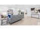 Stylish living room featuring modern art, a comfortable gray sofa, and open access to the kitchen area at 4500 22Nd N Ave, St Petersburg, FL 33713