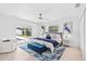 Serene main bedroom with modern decor, large windows, and direct access to the outdoor pool at 4500 22Nd N Ave, St Petersburg, FL 33713