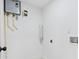 Close up of a utility room with a tankless water heater, plumbing connections, and electrical outlets at 4500 22Nd N Ave, St Petersburg, FL 33713