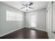 Bright bedroom with door to backyard, ceiling fan and a window at 4519 S Grady Ave, Tampa, FL 33611