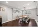 Spacious dining room featuring a large table with bench seating and stylish decor at 4519 S Grady Ave, Tampa, FL 33611
