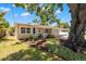 Charming home featuring a well-manicured front yard and quaint curb appeal at 4519 S Grady Ave, Tampa, FL 33611