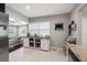 Bright kitchen featuring white tile floors, ample storage and a view to the dining area at 4519 S Grady Ave, Tampa, FL 33611