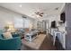 Comfortable living room features wood floors, ceiling fan, and lots of natural light at 4519 S Grady Ave, Tampa, FL 33611