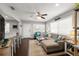 Cozy living room with hardwood floors, ceiling fan, and comfortable seating, offering a welcoming atmosphere at 4519 S Grady Ave, Tampa, FL 33611