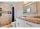 Elegant bathroom features include tiled shower, vanity with granite top and bronze fixtures at 503 Tangerine Dr, Oldsmar, FL 34677