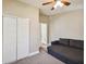 The bedroom features a ceiling fan, closet with sliding doors and neutral carpet and paint at 503 Tangerine Dr, Oldsmar, FL 34677