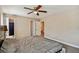 Spacious bedroom with an en suite bathroom and modern ceiling fan at 503 Tangerine Dr, Oldsmar, FL 34677
