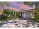 Charming home featuring a well-kept lawn, mature landscaping, and a one-car garage, creating inviting curb appeal at 503 Tangerine Dr, Oldsmar, FL 34677