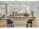 Contemporary kitchen with granite countertops, breakfast bar, and stainless steel appliances at 503 Tangerine Dr, Oldsmar, FL 34677
