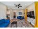 Beautiful living room showcasing the blue sofa set and wood flooring at 503 Tangerine Dr, Oldsmar, FL 34677