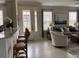 Open-concept living area with counter seating, natural light, and views into the living room at 5406 Rushmere Ct, Palmetto, FL 34221