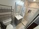 Bathroom featuring a modern single sink vanity and shower with neutral tones at 5554 Riva Ridge Dr, Wesley Chapel, FL 33544