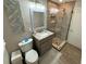 Modern bathroom with a glass shower, neutral tile, and updated vanity at 5554 Riva Ridge Dr, Wesley Chapel, FL 33544