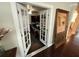 Elegant foyer with hardwood floors, statement lighting, and an open floor plan at 5554 Riva Ridge Dr, Wesley Chapel, FL 33544