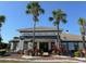 Lexington Oaks Golf Club featuring palm trees, beautiful landscaping, and meticulously maintained grounds at 5554 Riva Ridge Dr, Wesley Chapel, FL 33544