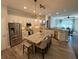This open kitchen features stainless steel appliances, a large island, and an open concept floor plan at 5554 Riva Ridge Dr, Wesley Chapel, FL 33544
