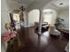 This living room features an open floor plan, wood floors, and natural light at 5554 Riva Ridge Dr, Wesley Chapel, FL 33544