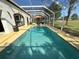 Beautiful backyard pool with an expansive view of the green golf course at 5554 Riva Ridge Dr, Wesley Chapel, FL 33544