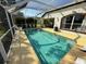Relaxing pool area with comfortable seating, a tranquil setting, and a scenic view at 5554 Riva Ridge Dr, Wesley Chapel, FL 33544