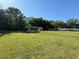 Community soccer field with a green playing surface and goal, surrounded by trees at 5554 Riva Ridge Dr, Wesley Chapel, FL 33544