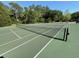A well-maintained tennis court provides the perfect place to enjoy a competitive match or improve your skills at 5554 Riva Ridge Dr, Wesley Chapel, FL 33544
