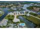 Sweeping aerial view of the community, showcasing waterfront properties, canals, and lush landscaping at 5712 Biscayne Ct # 205, New Port Richey, FL 34652
