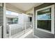Balcony featuring gray siding and white railings at 5712 Biscayne Ct # 205, New Port Richey, FL 34652