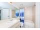 Clean bathroom showcasing a shower and tub combo with a blue curtain at 5712 Biscayne Ct # 205, New Port Richey, FL 34652