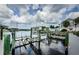 The dock features multiple boat slips and lifts, for easy water access and boat storage at 5712 Biscayne Ct # 205, New Port Richey, FL 34652