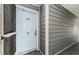 Exterior hallway with unit number and screen door shows entryway at 5712 Biscayne Ct # 205, New Port Richey, FL 34652